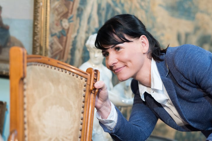 Shopper looking at secondhand furniture