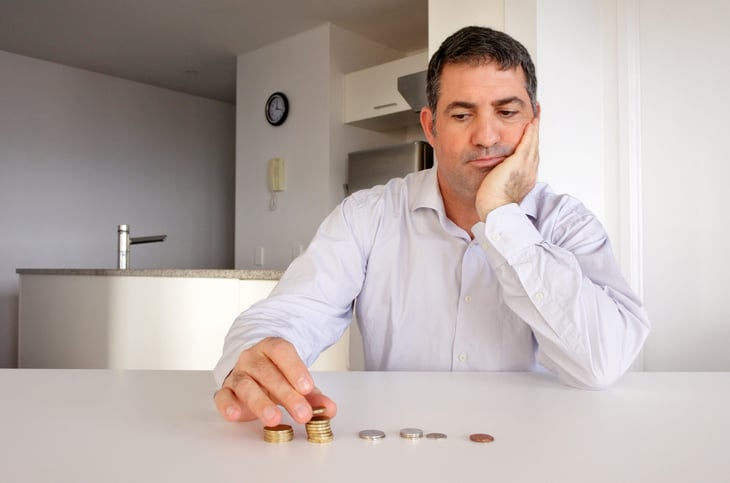 Man counting what is left of his money