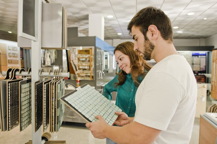 Couple shopping for tiles.