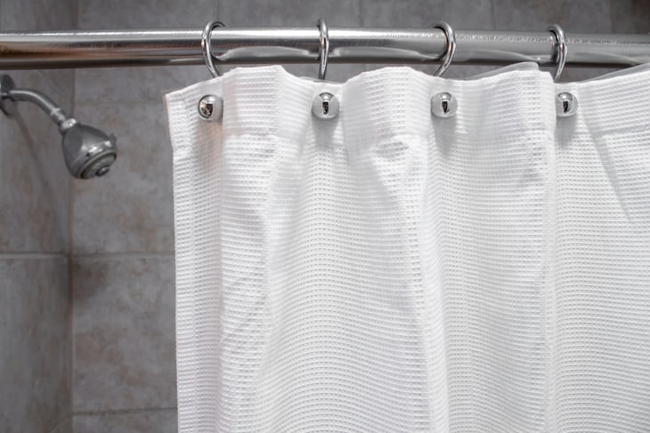Nice shower with a curtain.