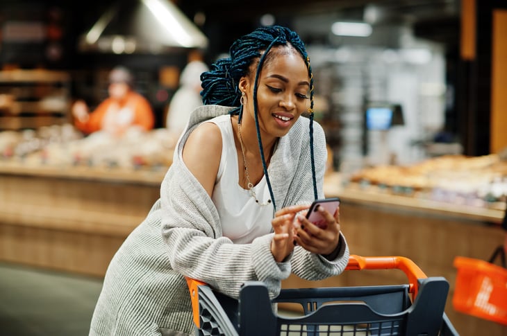 Happy woman in the grocery store