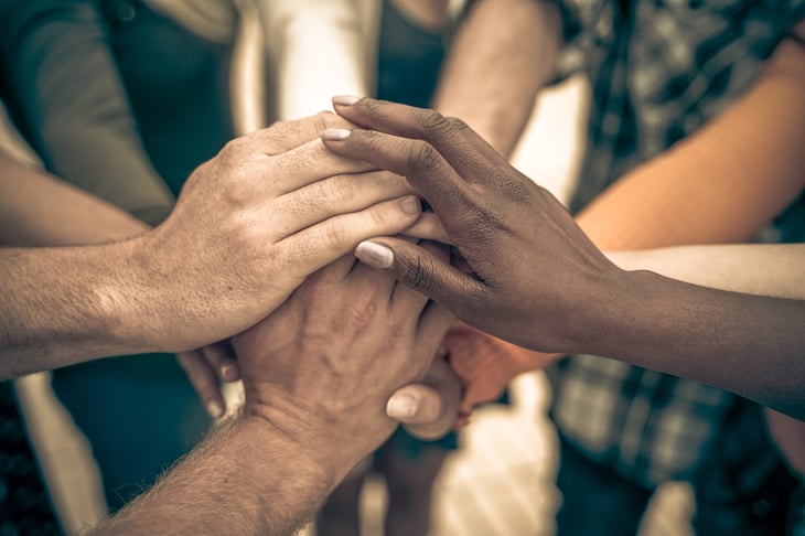 Hands together in unity