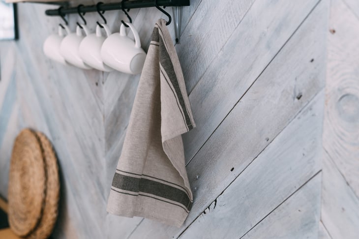 kitchen towel with mugs on rack