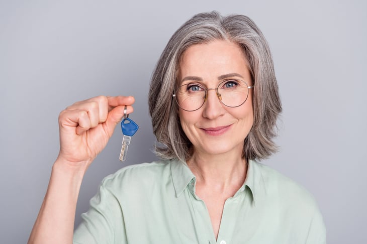 Senior woman holding house key