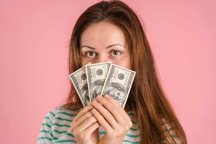 Woman holding money