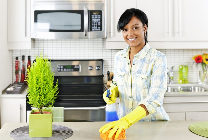 Woman cleaning her kitchen
