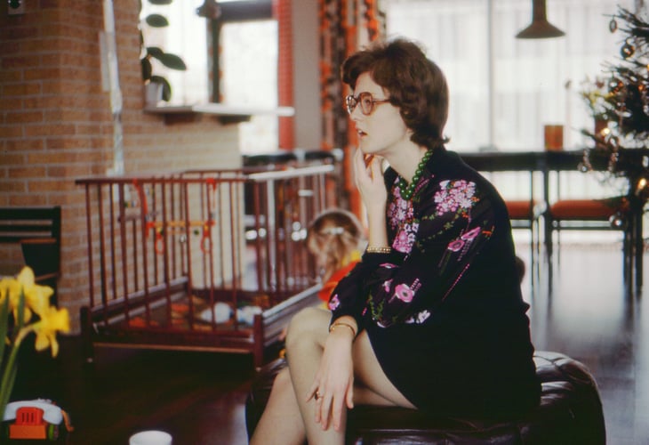 Woman sitting in her home in 1973