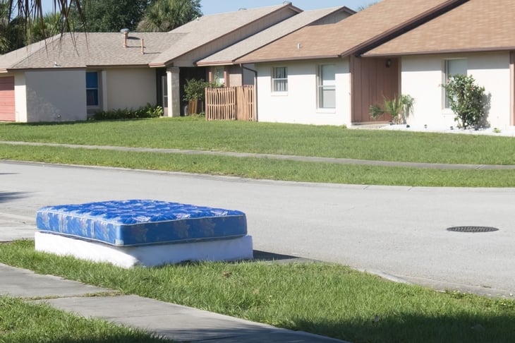 mattress and box spring on curb