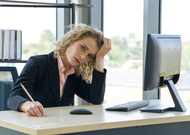 Stressed businesswoman at work