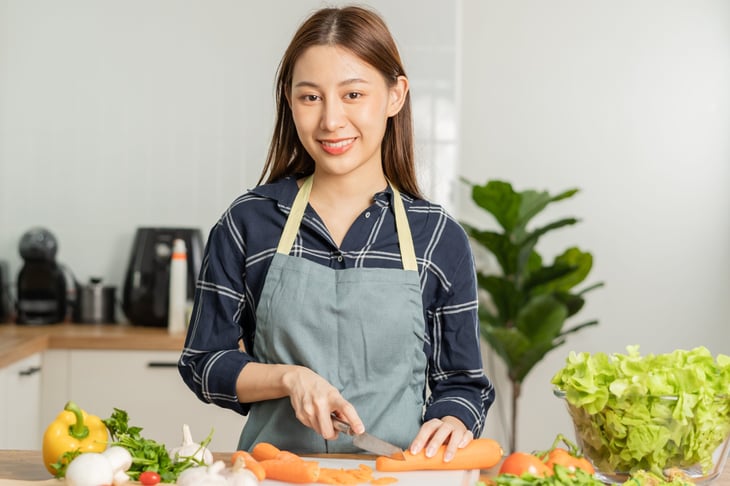 Woman chopping vegetables