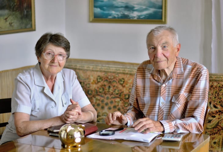 senior couple working on budget