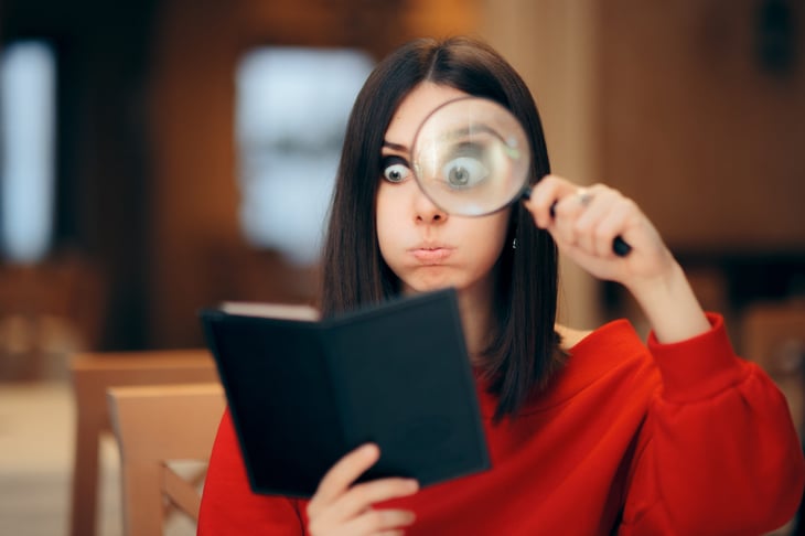 Woman looking at restaurant bill