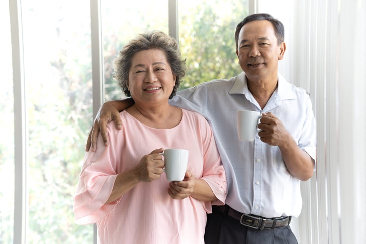 Older couple at home drinking coffee