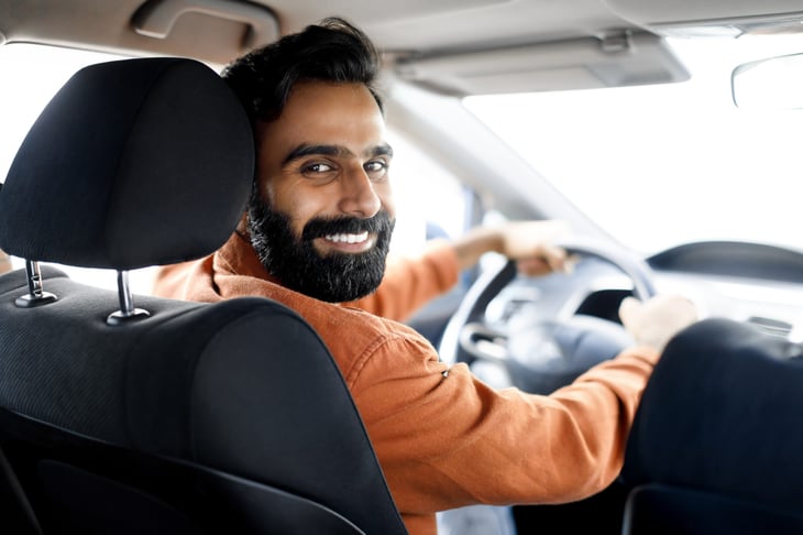 Happy man driving his car