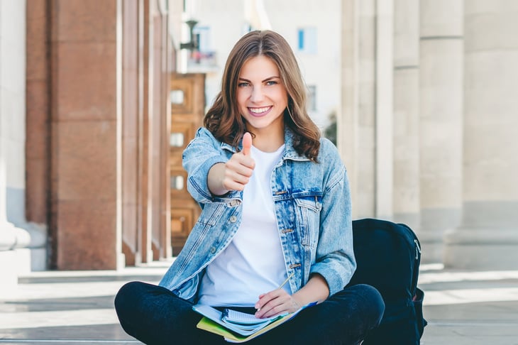 Student giving thumbs up