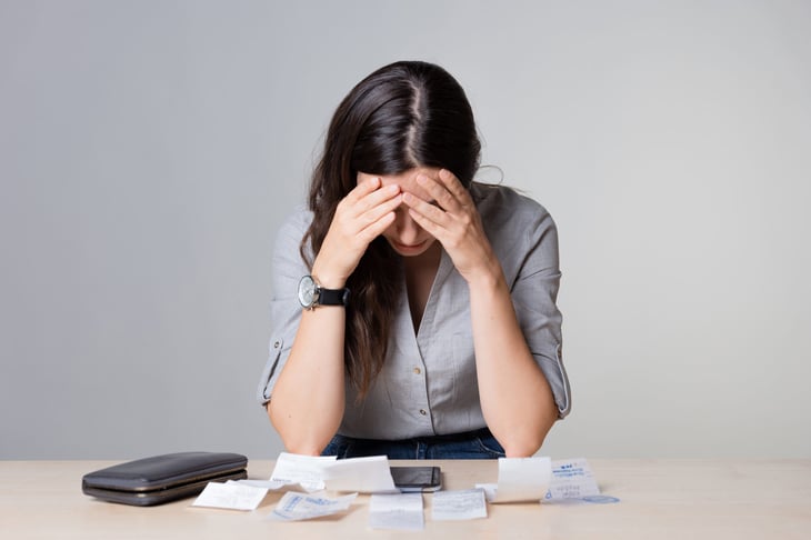 woman overspending distraught