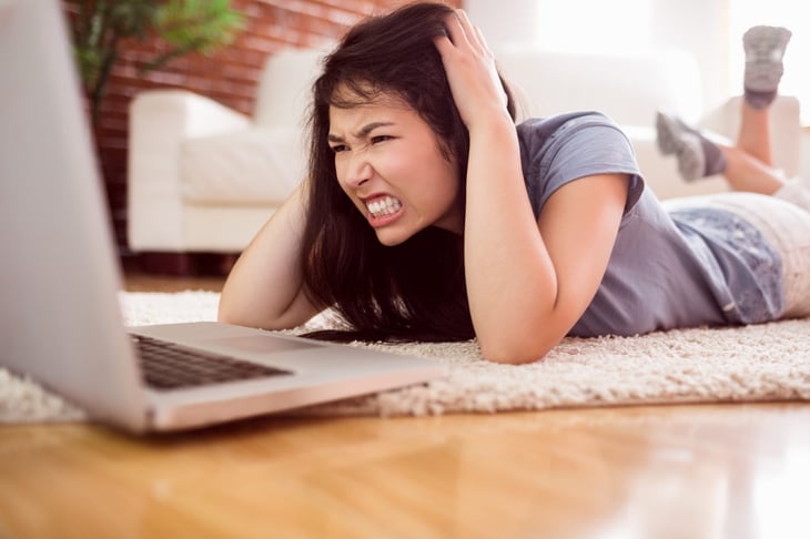 Frustrated woman on a computer