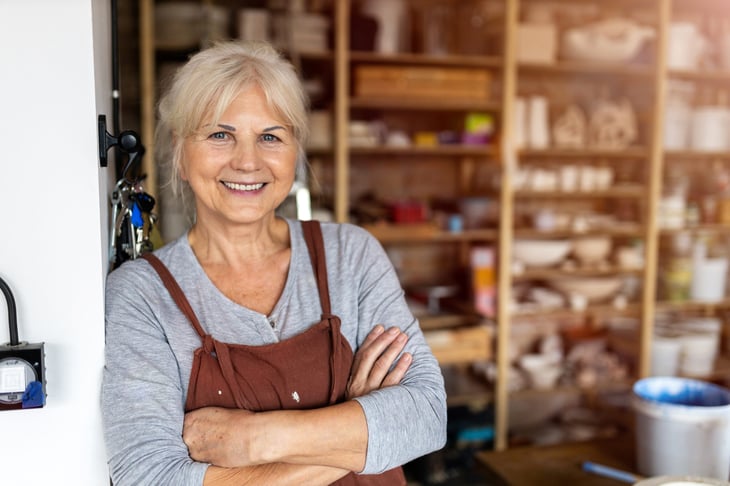 Happy senior woman in an art studio