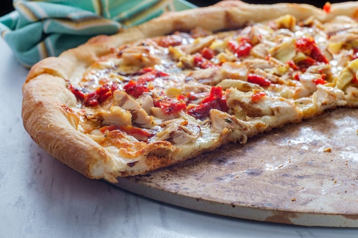 Pizza baked on a pizza stone