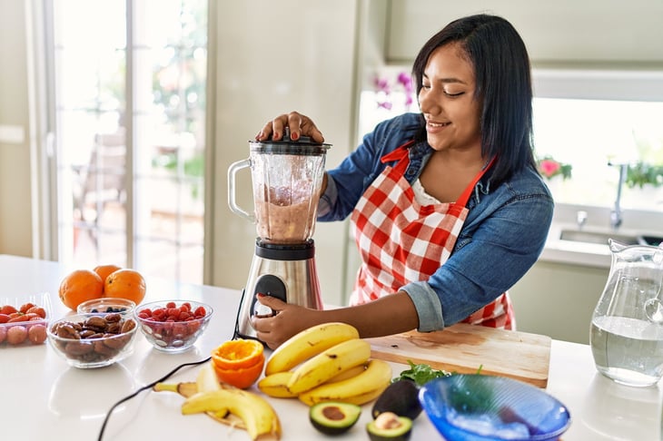 Woman making a smoothie