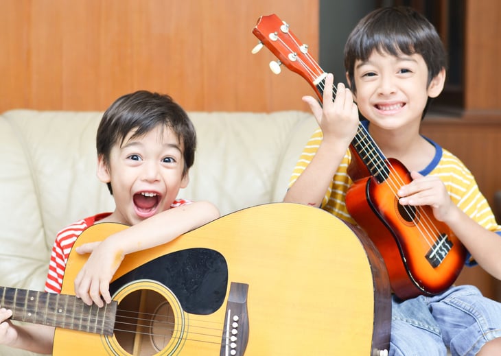 Kids playing with musical instruments