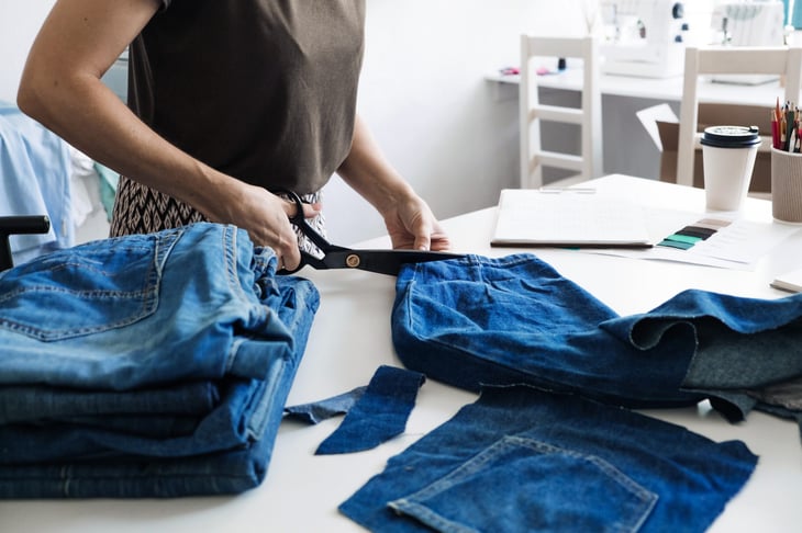 Woman upcyling denim jeans