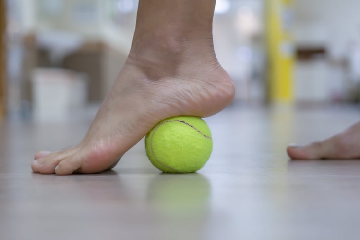 Tennis ball used as foot massager