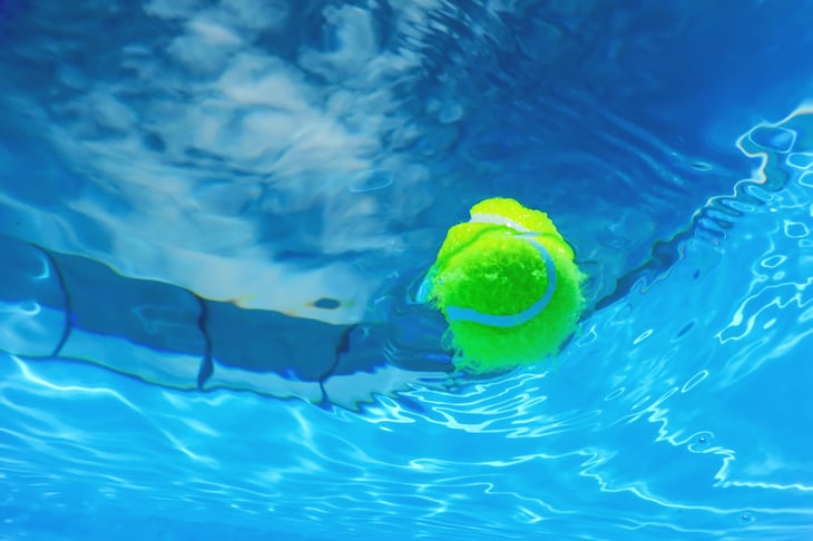 Tennis ball in a swimming pool