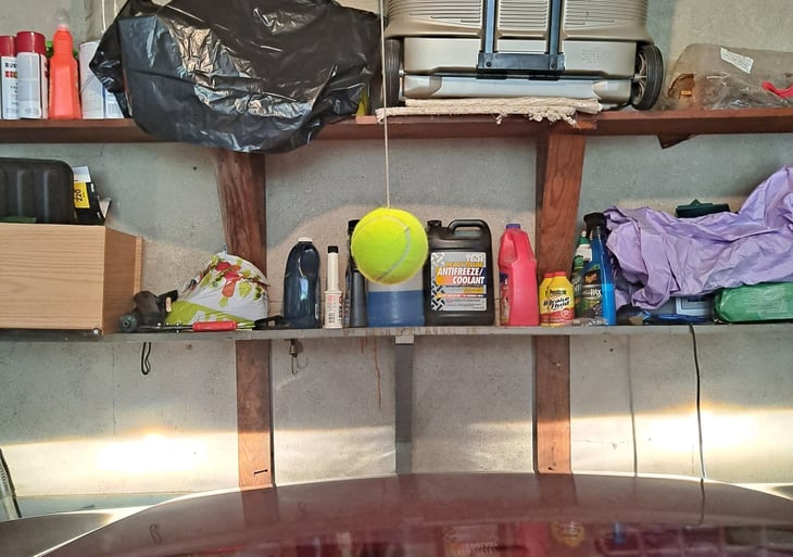Tennis ball used as a garage parking guide