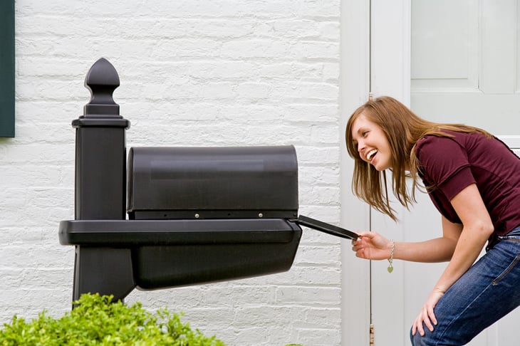Woman checking her mailbox