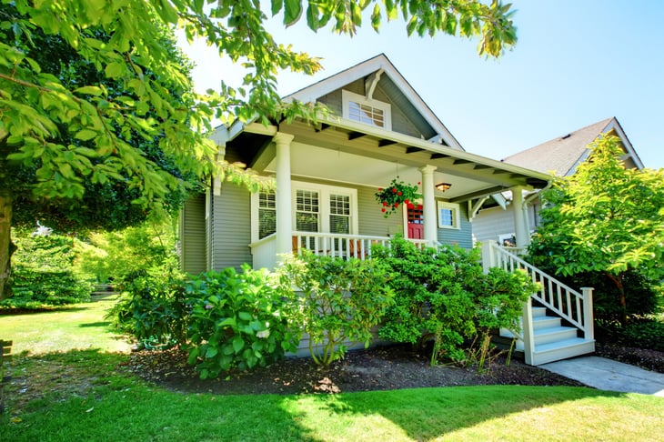 Small house with front porch in summer
