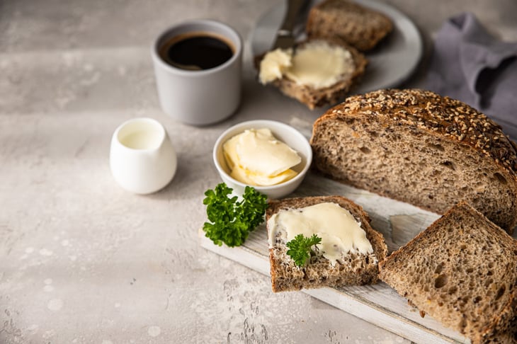 Multigrain bread, butter and coffee for breakfast