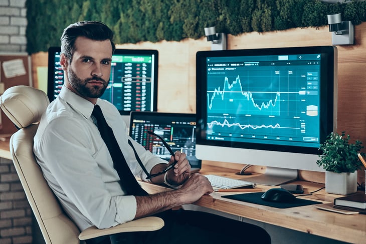 Investor looking at the stock market on his computer