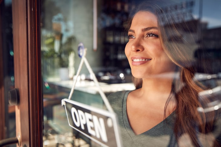 Businesswoman opening her business for the day