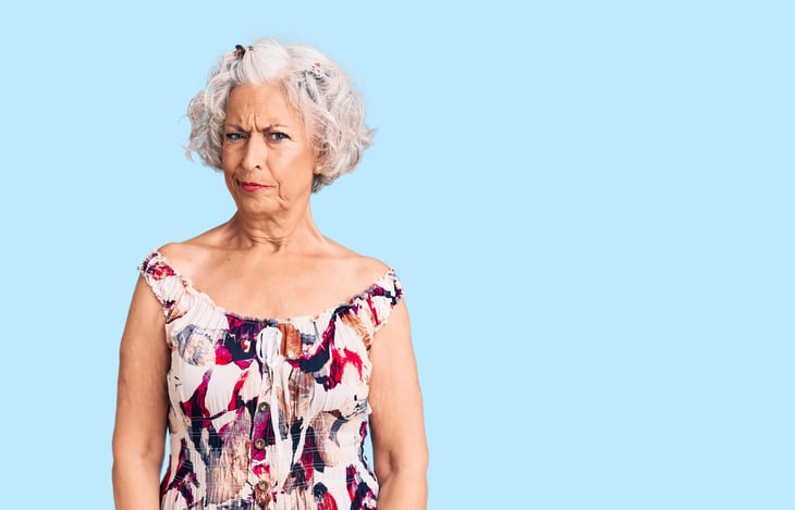 Skeptical senior woman