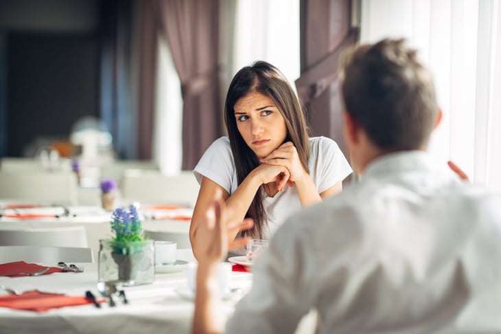 Woman doubting man, unsure who is telling the truth or lying