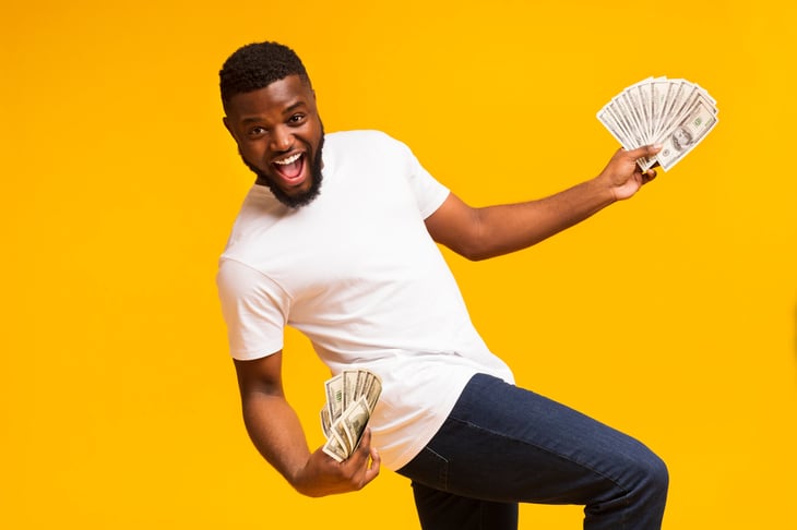 Happy man holding money