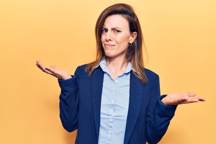 Skeptical confused woman is doubtful about a scam or deal