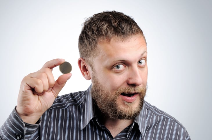Man holding a coin