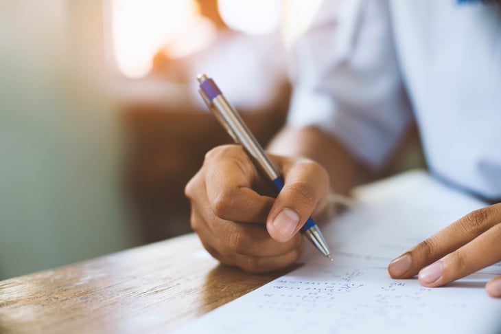 Hand writing with a pen, taking notes