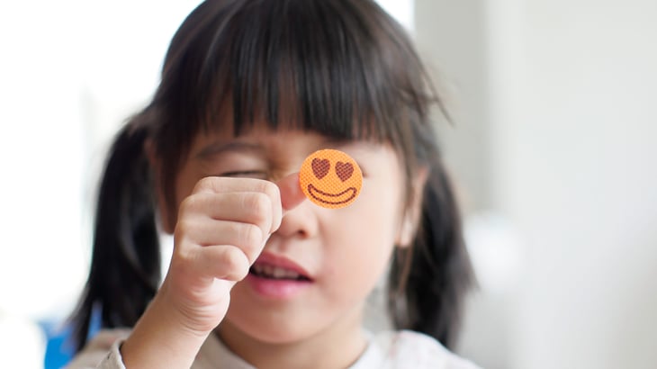 Child with a happy face heart eyes sticker