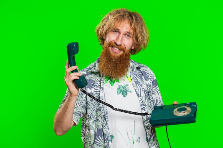 man with rotary phone