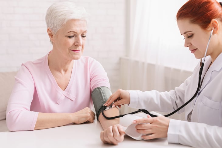 Woman getting blood pressure check