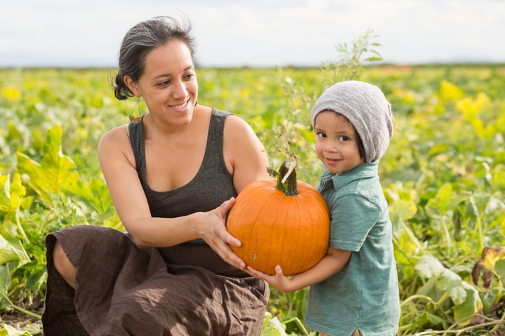 Mother and child in the pumpkin patch