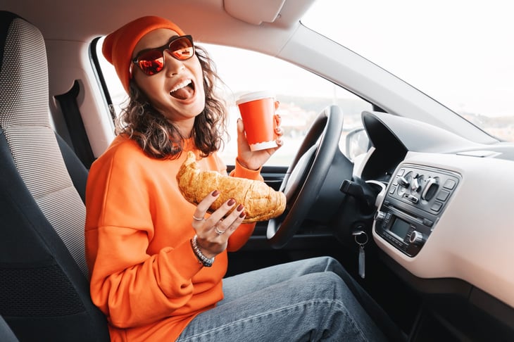 Driver eating in her car