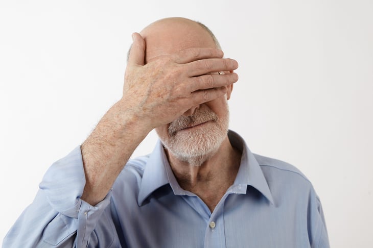 Embarrassed senior man
