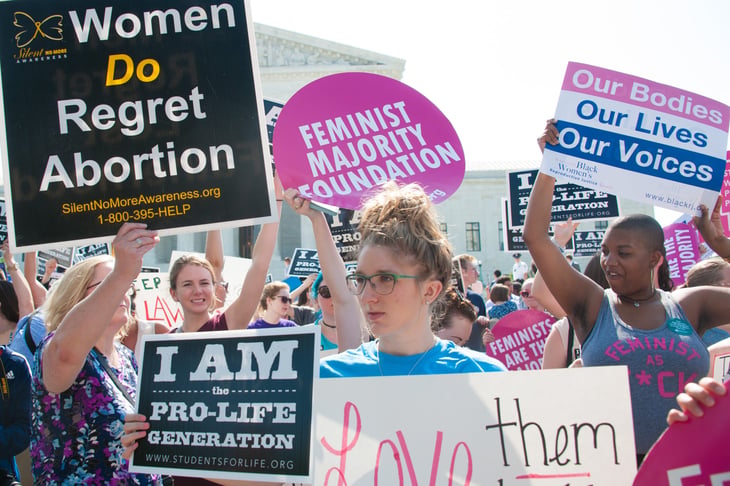 Pro-life and pro-choice abortion protesters