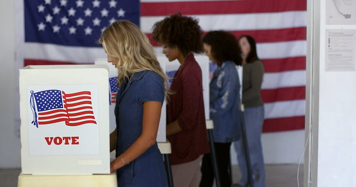 American voters in the voting booth participating in the election at the polls