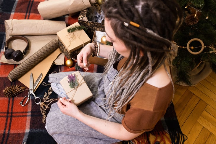Woman wrapping holiday gifts