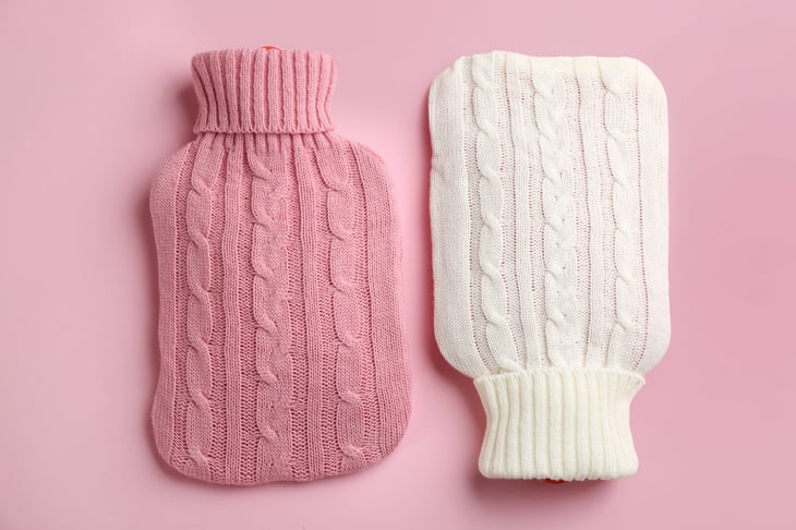 Hot water bottles with knitted covers